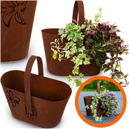 Rustic metal planter with handle, cut-out floral pattern, natural rusty finish